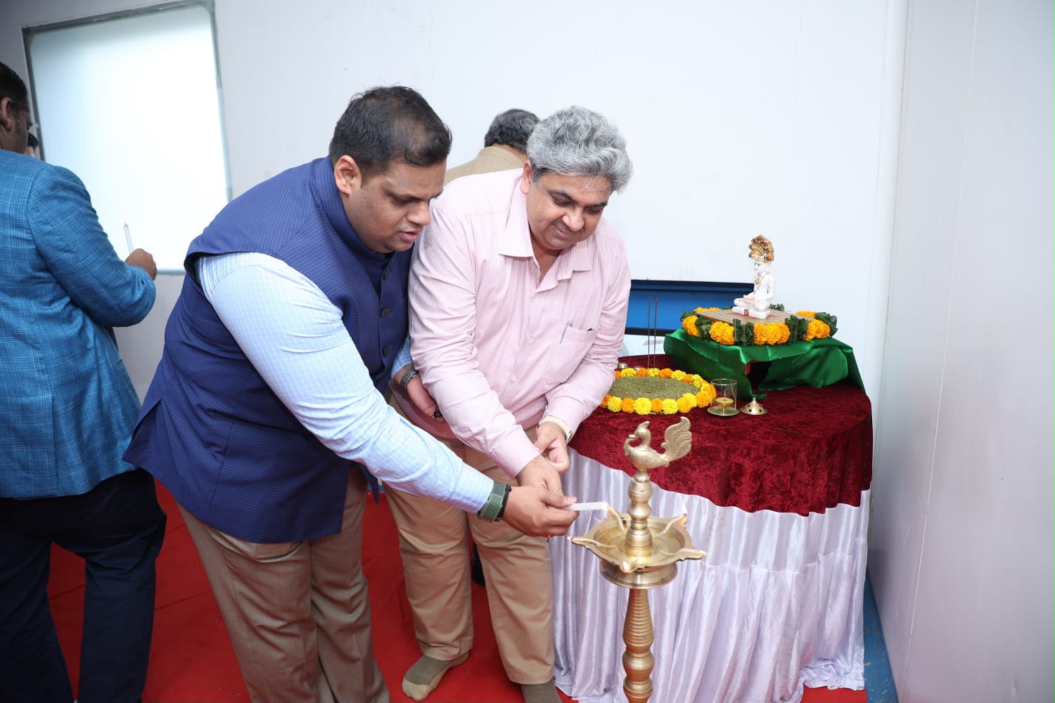 Lamp lighting at the puja table