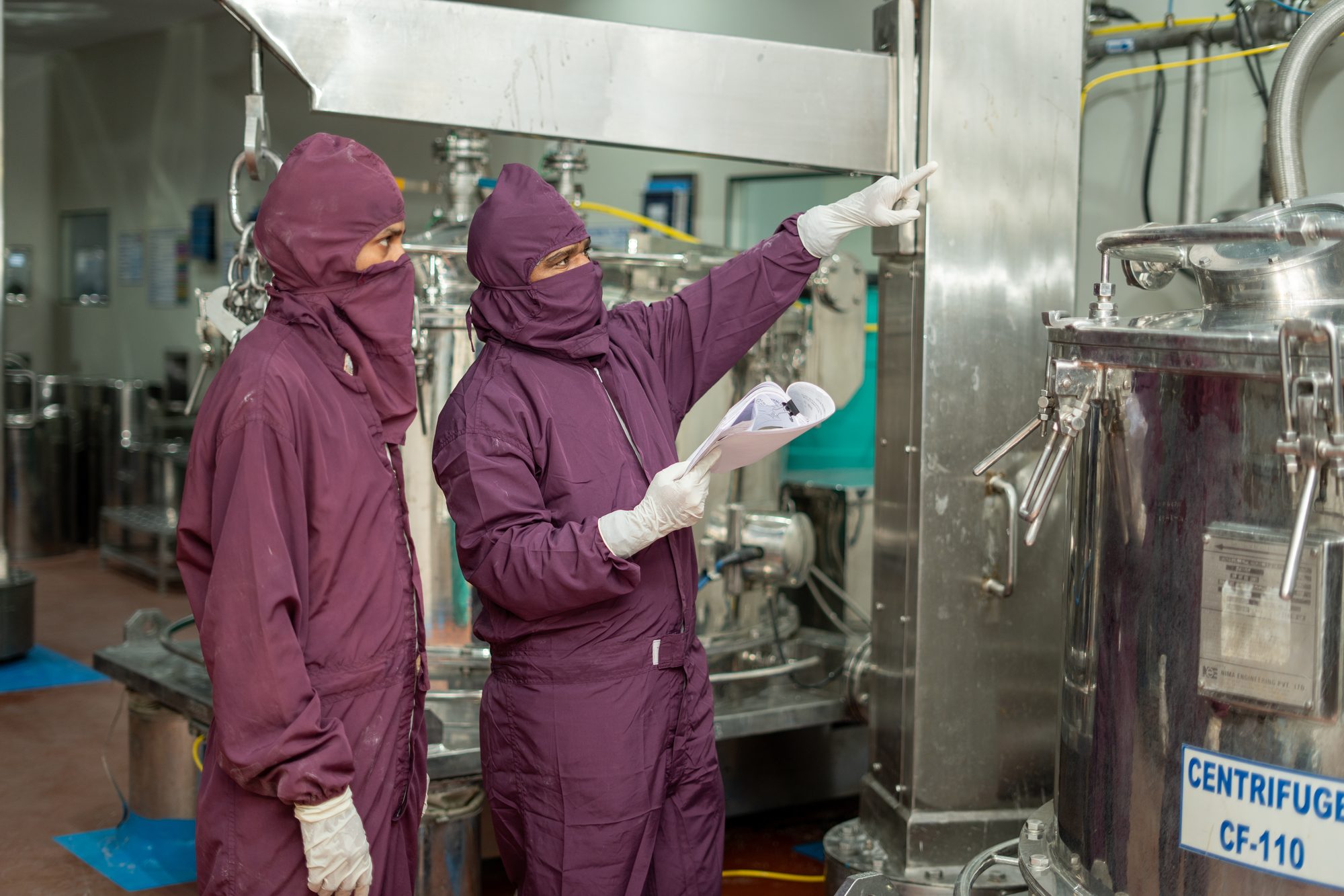 Operators at a centrifuge